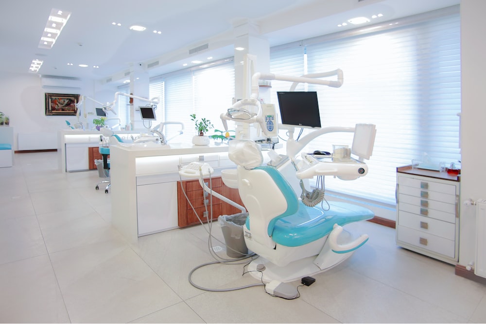 Luma Dental House calm reception lounge with warm wood and plants