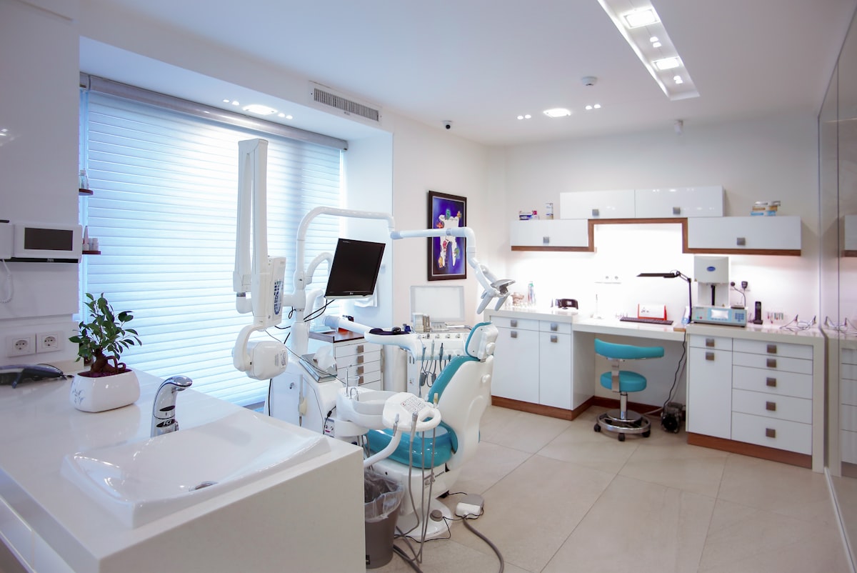 Dentist co-reviewing 3D scans with a patient on a display